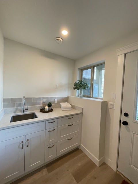 Laundry nook with new cabinets and sink